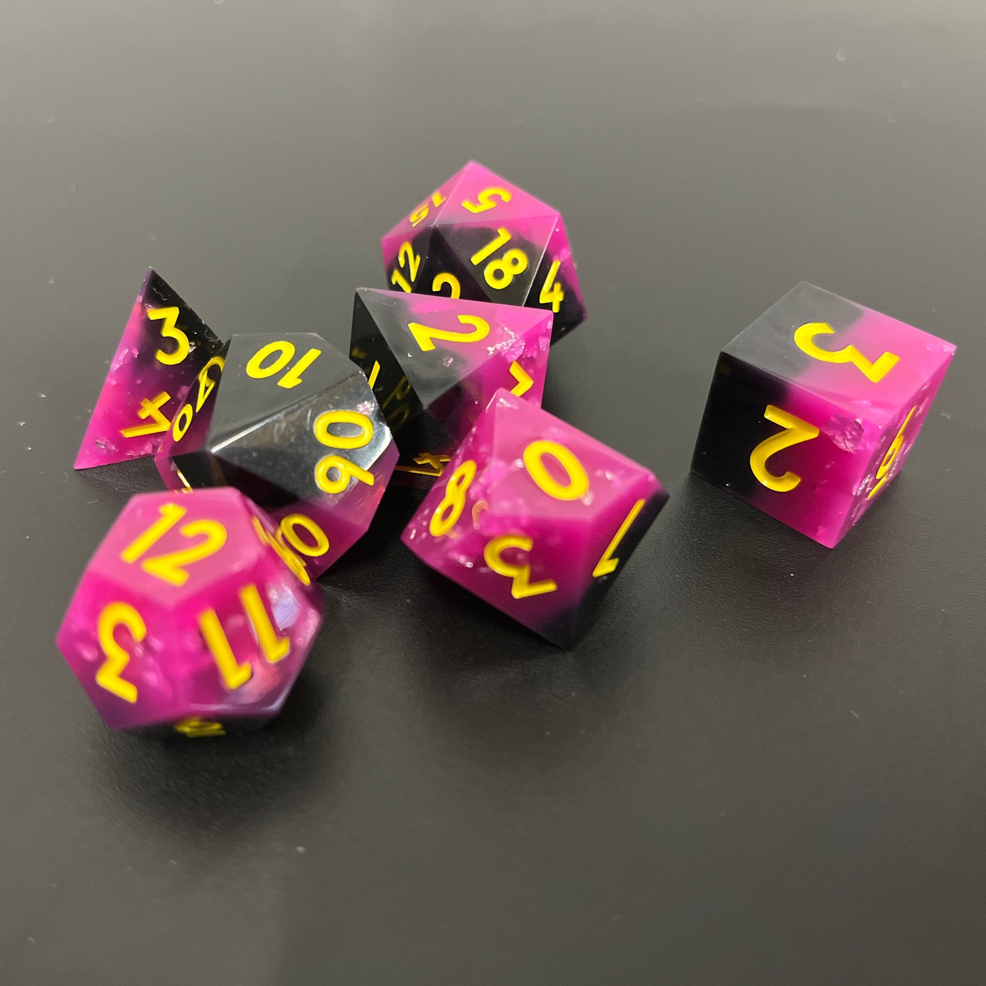 Punk Is Dead DND sharp edge dice, vibrant hot pink, black finished with neon yellow fonts for a music RPG